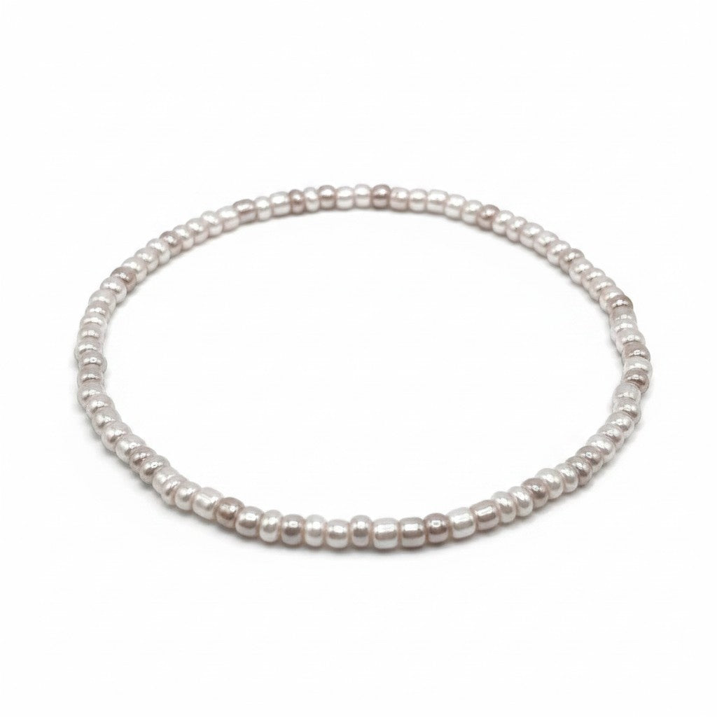 Handmade by Erika Liesel pearl gray stretch bracelet featuring delicate 3mm glass beads with a luminous finish.