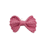 Handmade by Erika Liesel pink crochet bow hair tie with a soft, textured yarn finish and durable elastic band.