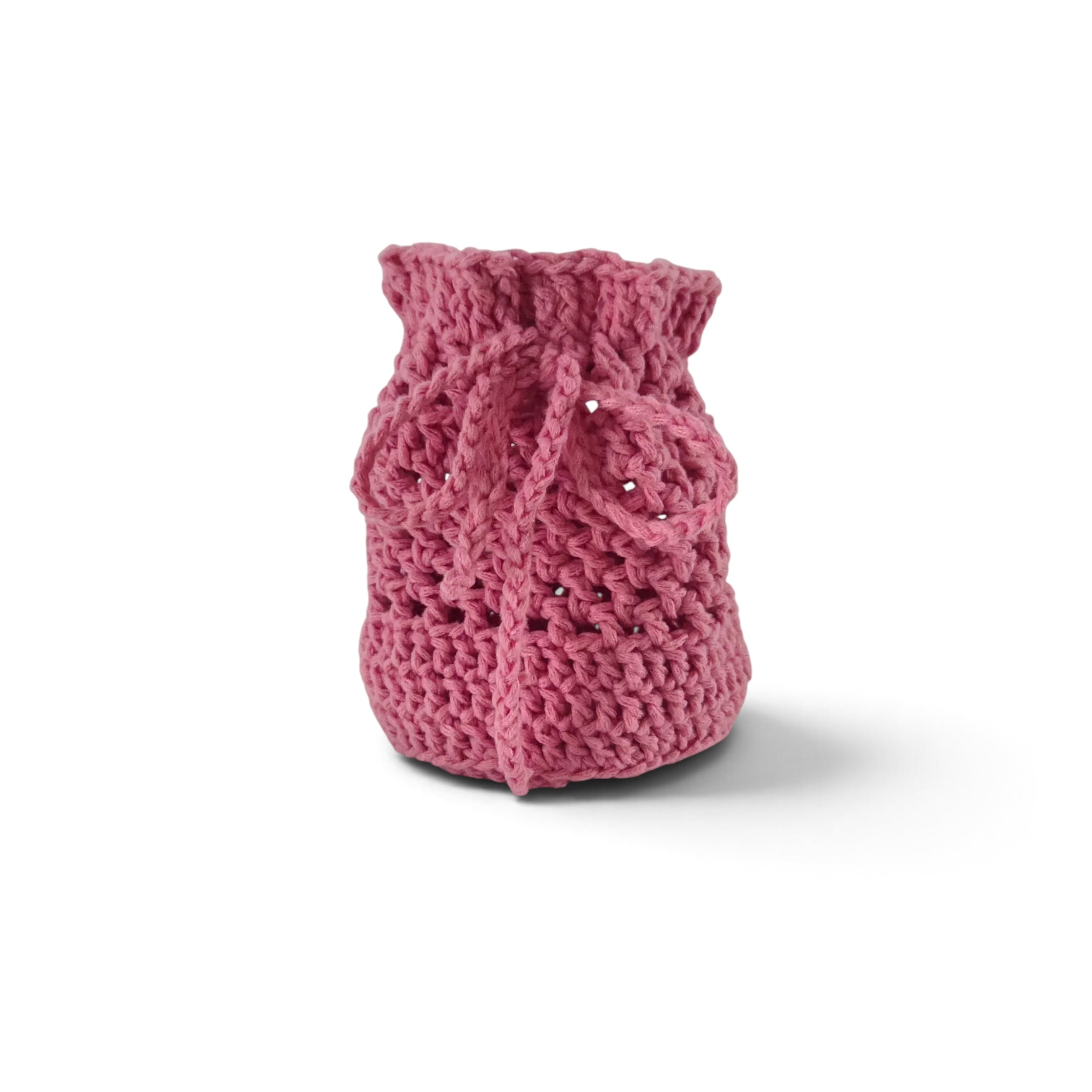 Handmade by Erika Liesel pink crochet drawstring bag made from soft premium yarn for jewelry or gift storage.