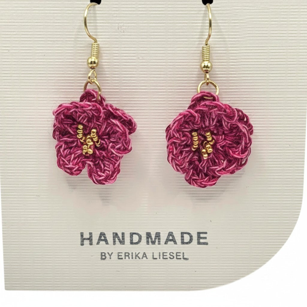Handmade by Erika Liesel Bloom crochet flower earrings in deep pink with gold bead accents on hypoallergenic hooks.