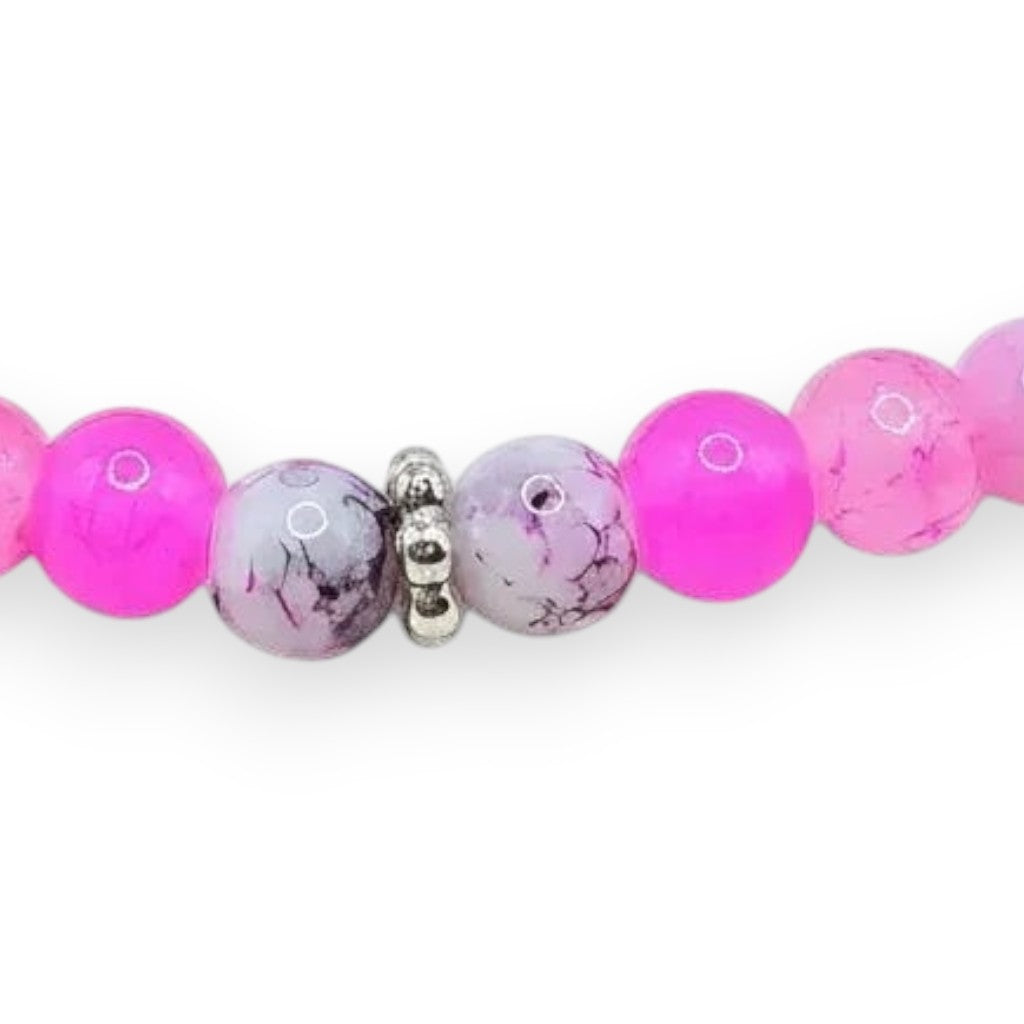 Handmade by Erika Liesel Pink Petal Bracelet featuring blush, bubblegum, and marbled pink glass beads with silver spacers