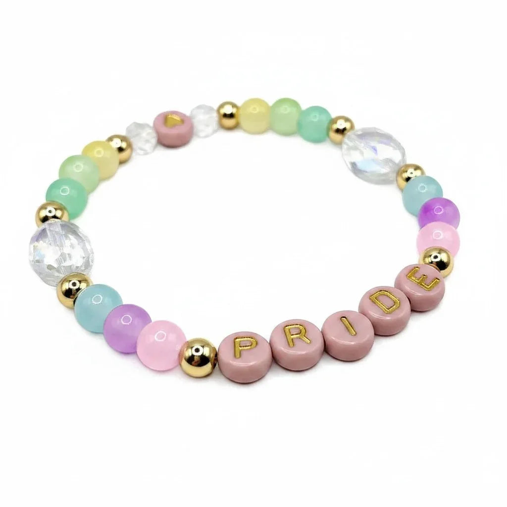Handmade by Erika Liesel Pride bracelet featuring pastel crystal beads and 18K gold-plated accents on elastic cord