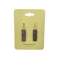 Handmade coconut shell earrings with gold hoops on yellow card, eco-friendly sustainable jewelry