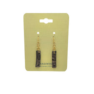 Handmade coconut shell earrings with gold hooks on pale yellow card, eco-friendly boho jewelry