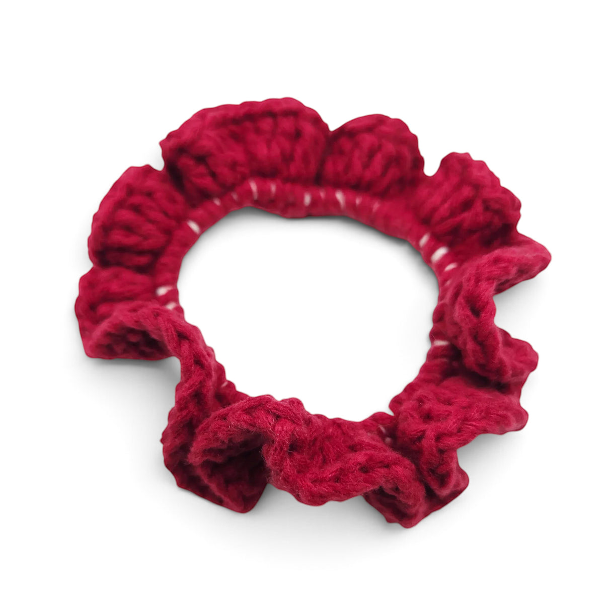 Handmade by Erika Liesel deep red crochet scrunchie with a soft, textured, and ruffled design for hair styling.