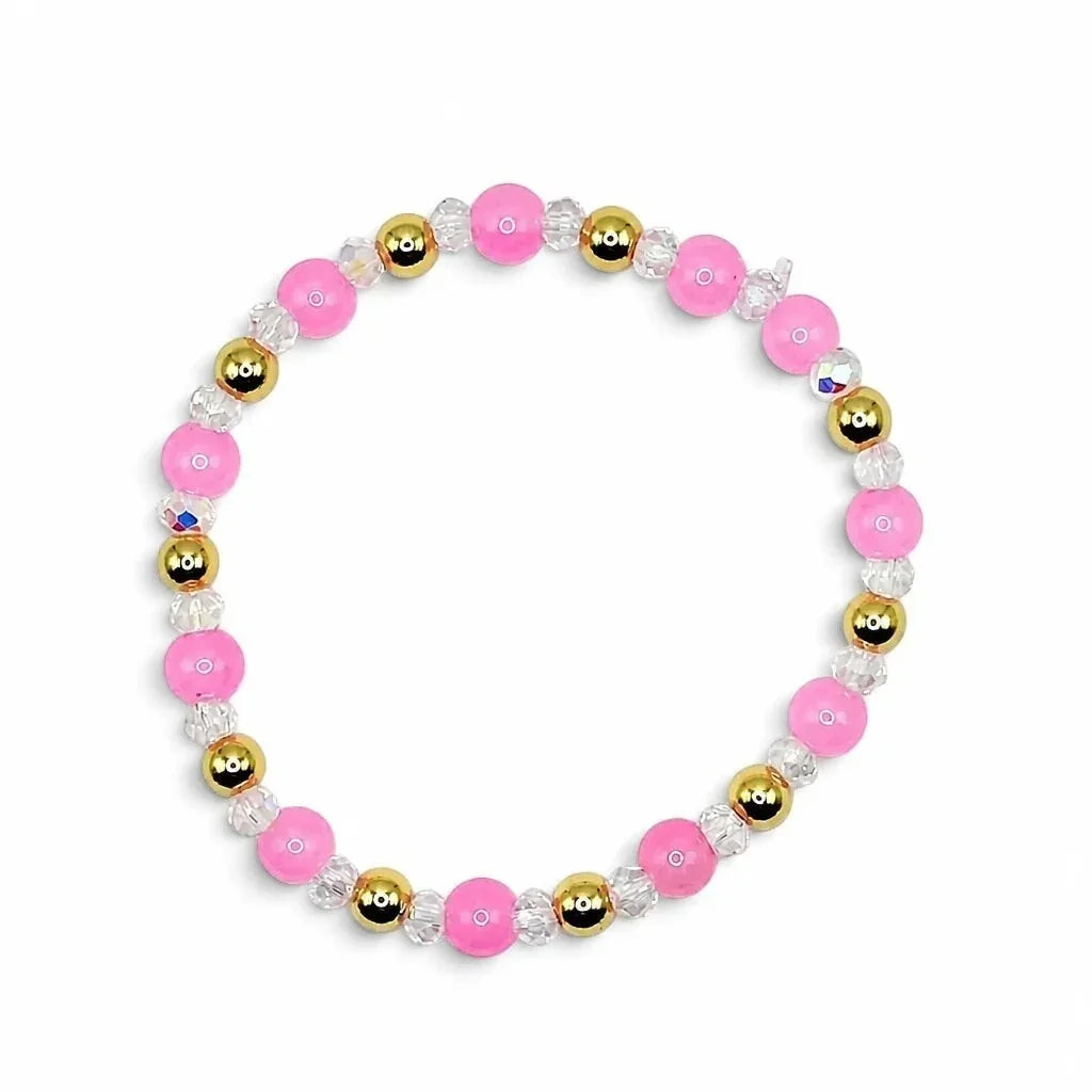 Handmade by Erika Liesel stretch bracelet featuring pink glass beads, clear crystal accents, and 18K gold-plated beads.
