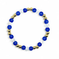 Handmade by Erika Liesel sapphire bracelet featuring cobalt blue glass beads, clear crystals, and 18K gold-plated accents.