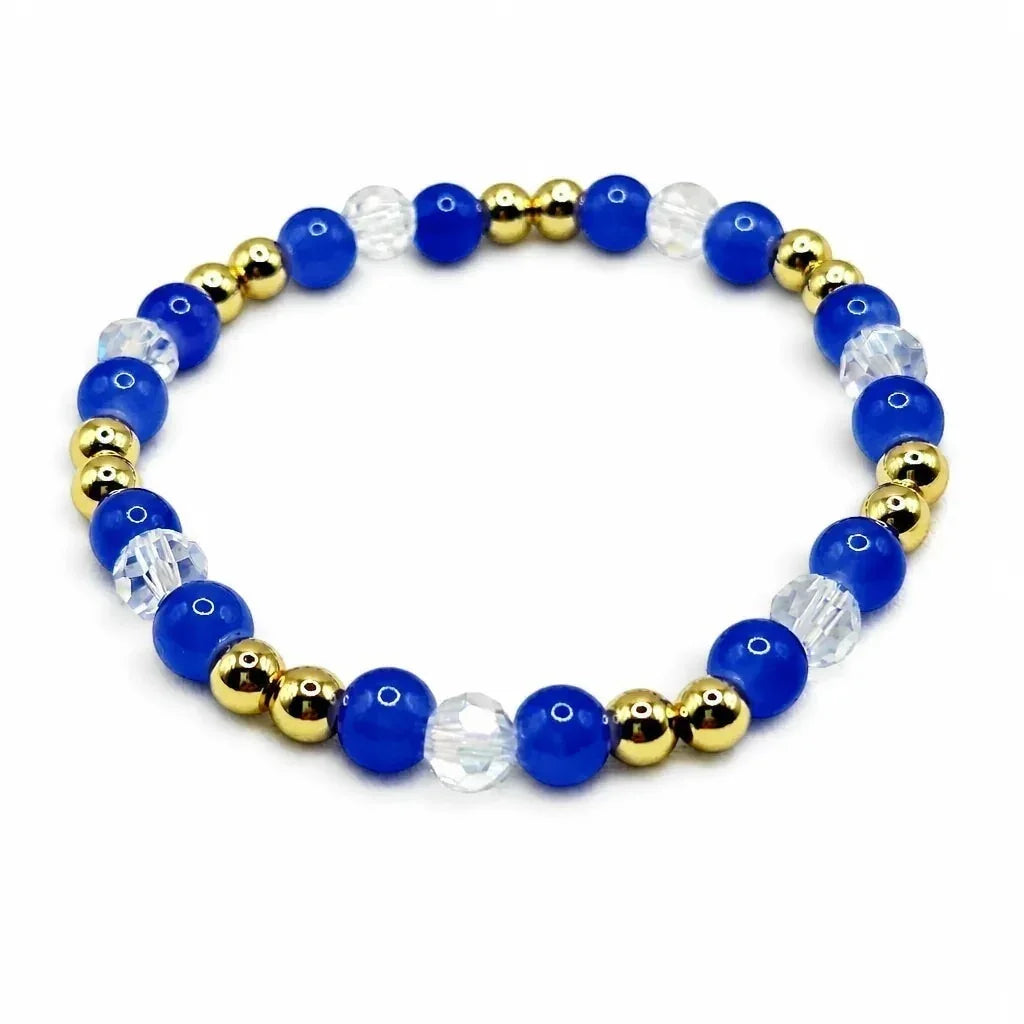 Handmade by Erika Liesel sapphire blue glass bead bracelet with clear crystal accents and 18K gold-plated beads.