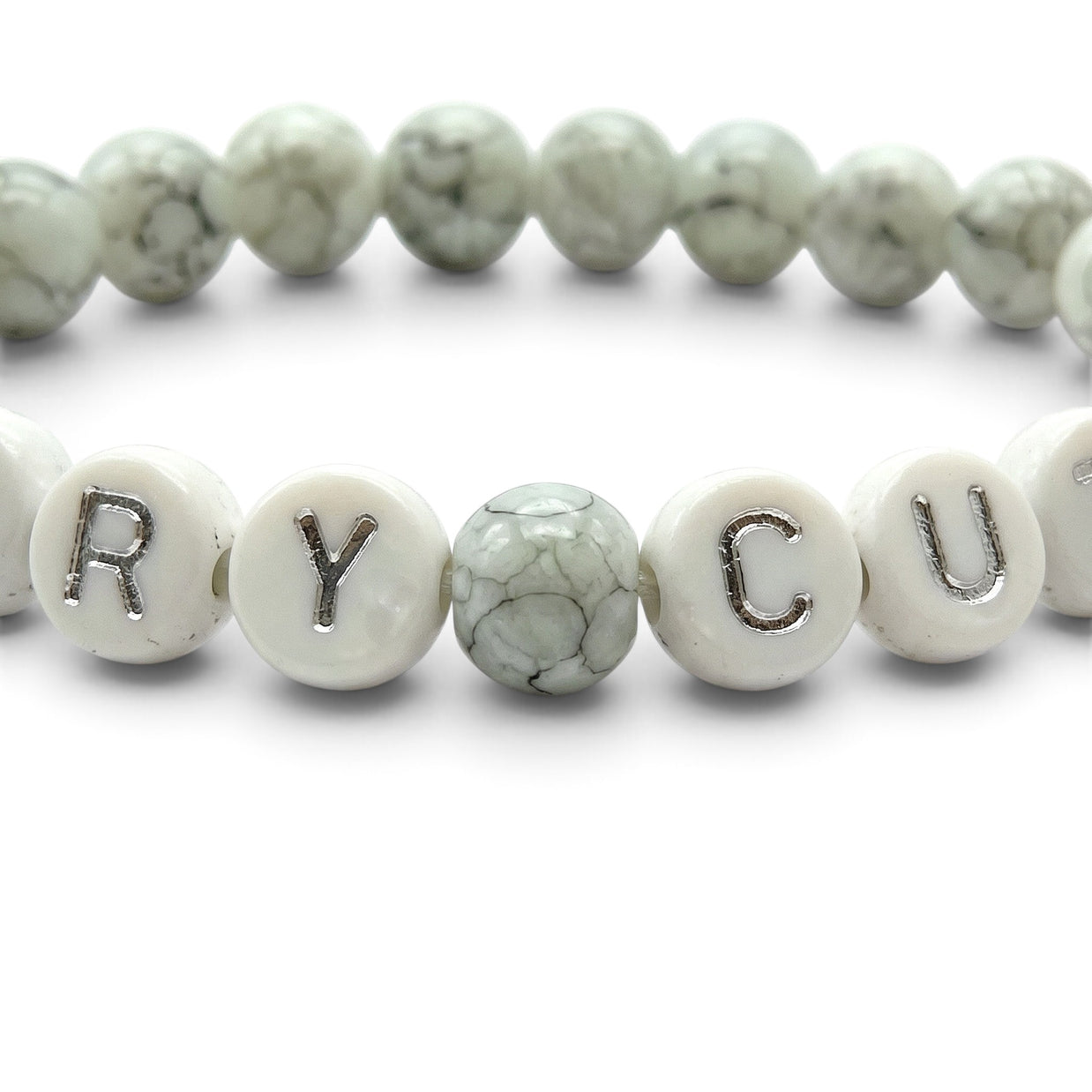 Handmade by Erika Liesel Scary Cute bracelet with gray marbled glass beads and white letter beads on elastic cord