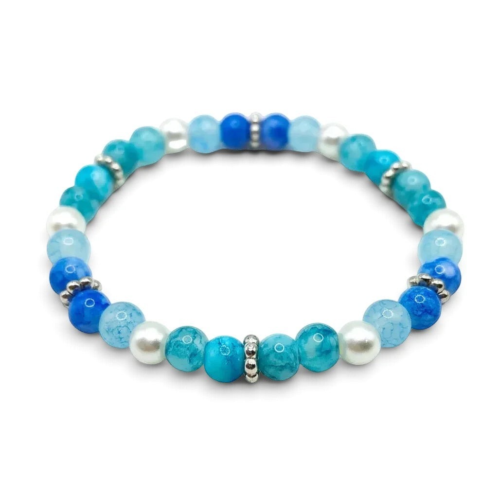 Handmade by Erika Liesel Sea Mist stretch bracelet with aqua and blue glass beads, faux pearls, and silver spacers.