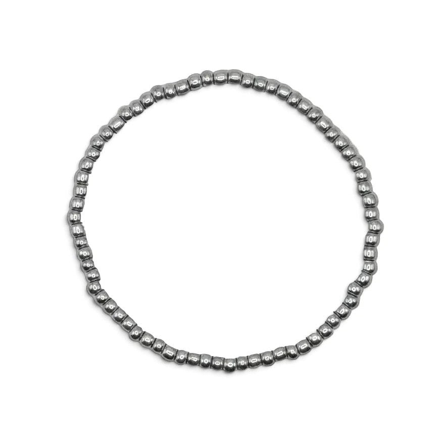 Handmade by Erika Liesel silver-toned stretch bracelet featuring 3mm glass beads on a durable elastic cord.