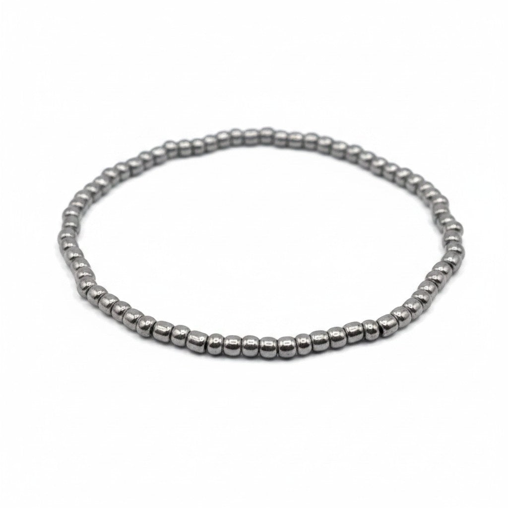Handmade by Erika Liesel silver-toned stretch bracelet featuring 3mm glass beads on a durable elastic cord.