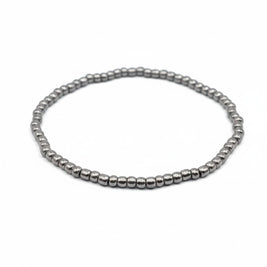 Handmade by Erika Liesel silver-toned stretch bracelet featuring 3mm glass beads on a durable elastic cord.