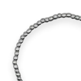 Handmade by Erika Liesel silver-toned stretch bracelet featuring 3mm glass beads on a durable elastic cord.