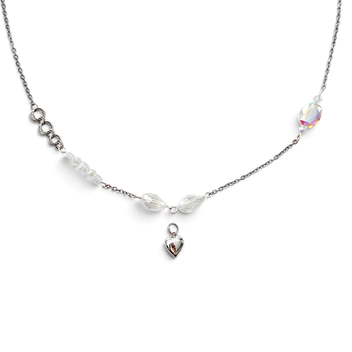 Handmade by Erika Liesel silver layering necklace with iridescent crystal glass accents and a small heart charm.