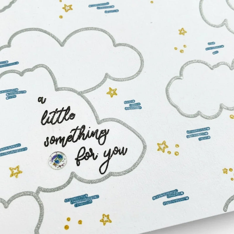 Handmade by Erika Liesel greeting card featuring a hand-drawn sky design with clouds, stars, and a thoughtful message.