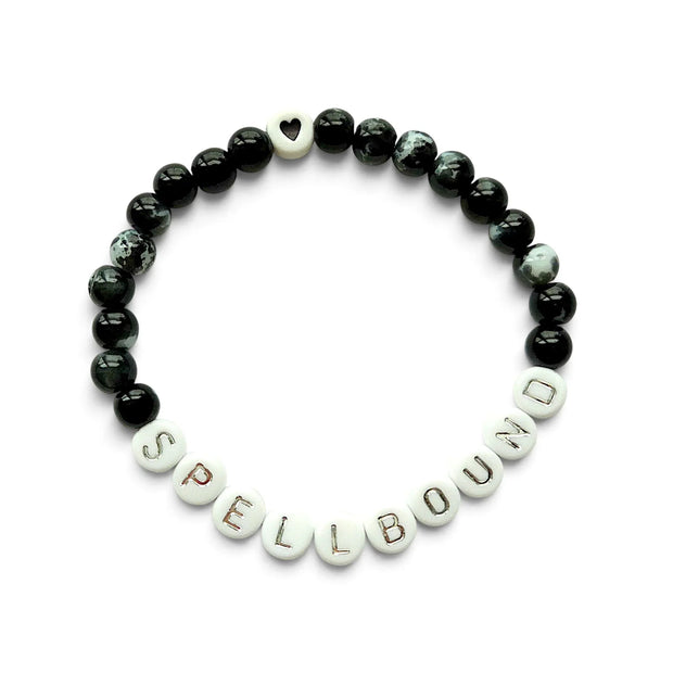 Handmade by Erika Liesel Spellbound stretch bracelet with glossy black glass beads and silver lettered beads.