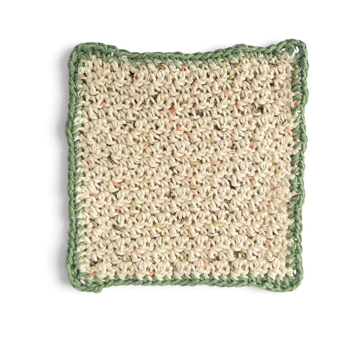 Handmade by Erika Liesel square crocheted cotton placemat in beige with a textured green border