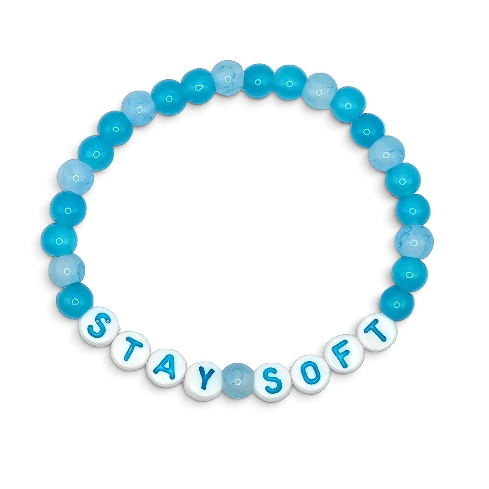 Handmade by Erika Liesel Stay Soft stretch bracelet featuring bright and pale blue glass beads with white letter beads.