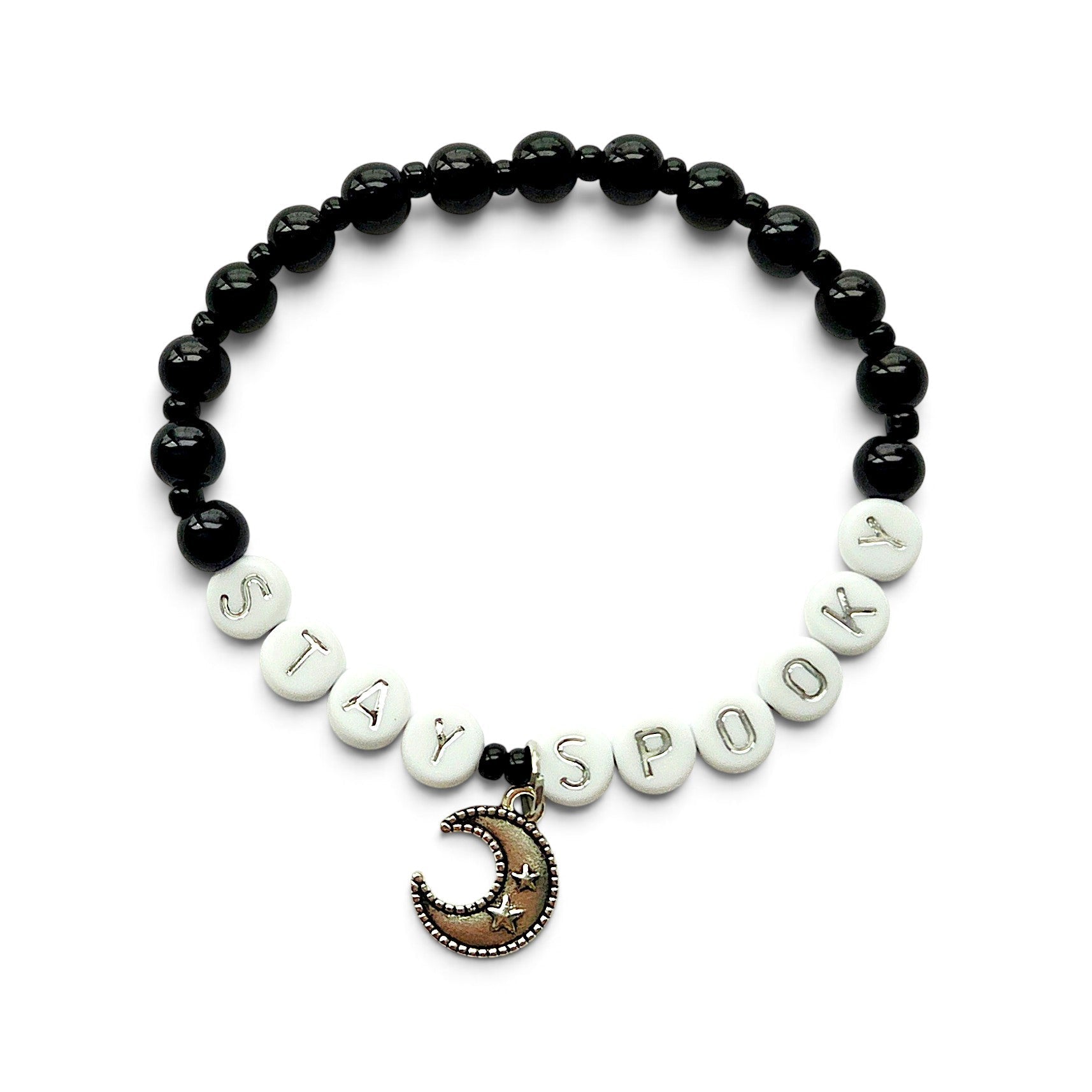 Handmade by Erika Liesel Stay Spooky bracelet with black glass beads, white letter beads, and a crescent moon charm.