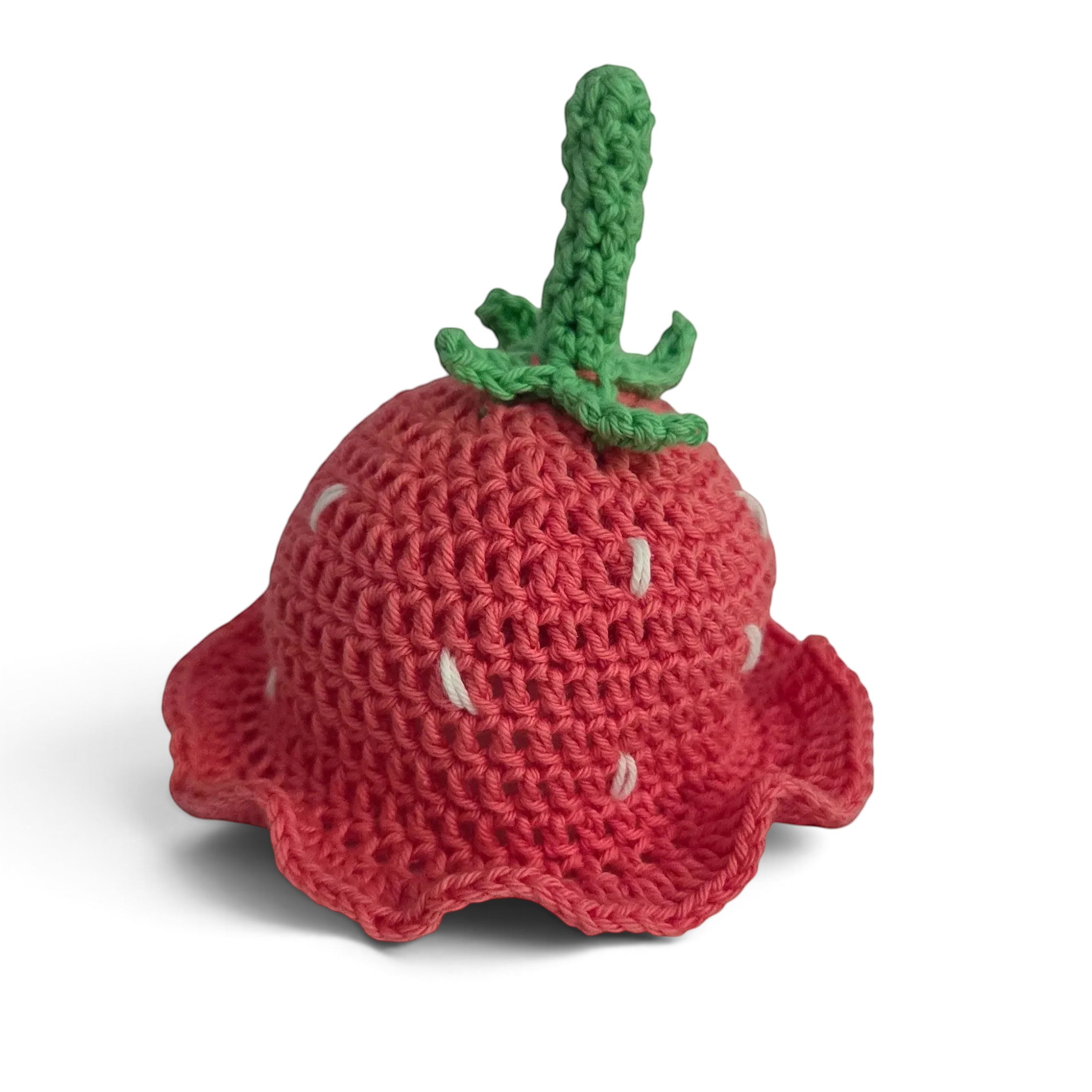 Handmade by Erika Liesel hand-crocheted red strawberry gnome hat with green stem and white seed details