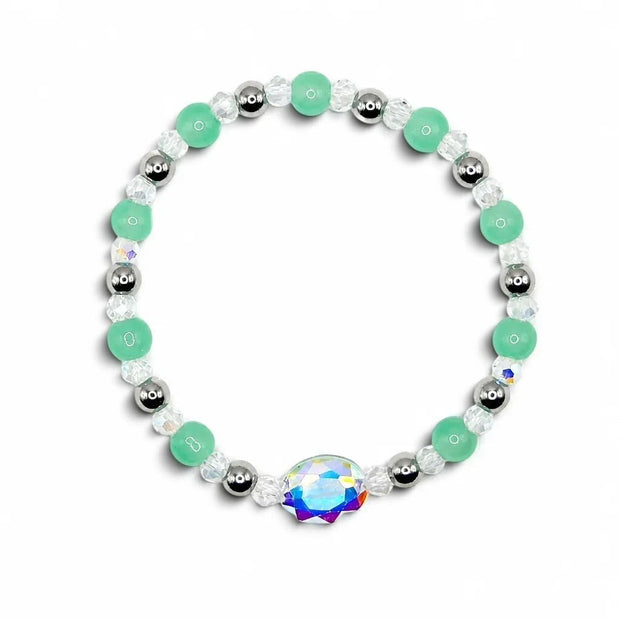 Handmade by Erika Liesel Tidepool stretch bracelet with seafoam green glass beads, silver accents, and crystal charm.