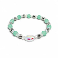 Handmade by Erika Liesel Tidepool stretch bracelet with seafoam green glass beads, silver accents, and crystal center