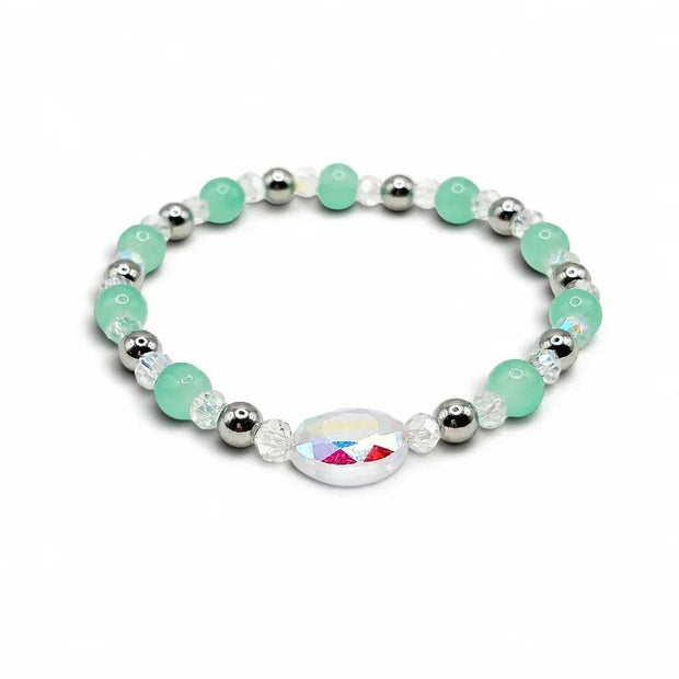 Handmade by Erika Liesel Tidepool stretch bracelet with seafoam green glass beads, silver accents, and crystal center