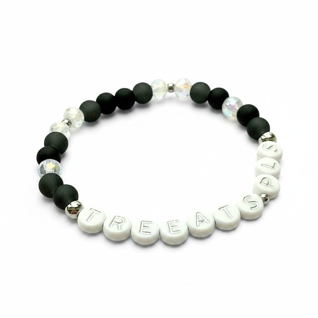 Handmade by Erika Liesel Treats Pls stretch bracelet with matte black glass, iridescent crystal, and letter beads.