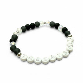 Handmade by Erika Liesel Treats Pls stretch bracelet with matte black glass, iridescent crystal, and letter beads.