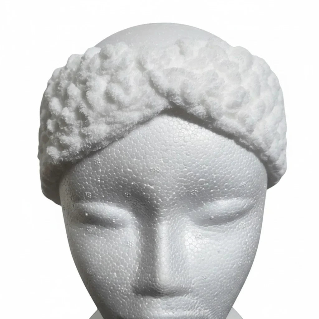 Handmade by Erika Liesel white crochet kids ear warmer with a textured twist design on a mannequin head