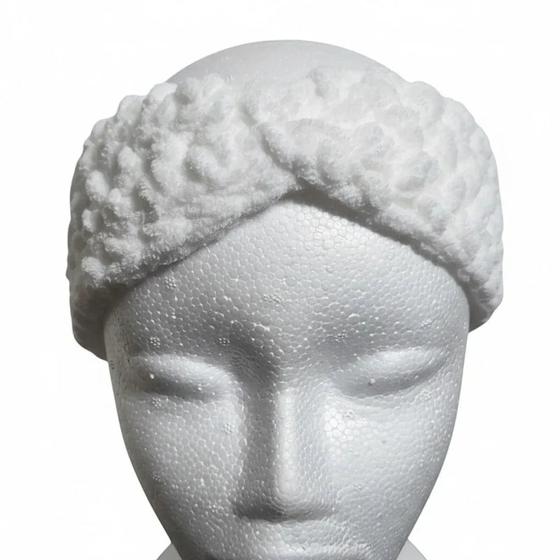 Handmade by Erika Liesel white crochet kids ear warmer with a textured twist design on a mannequin head