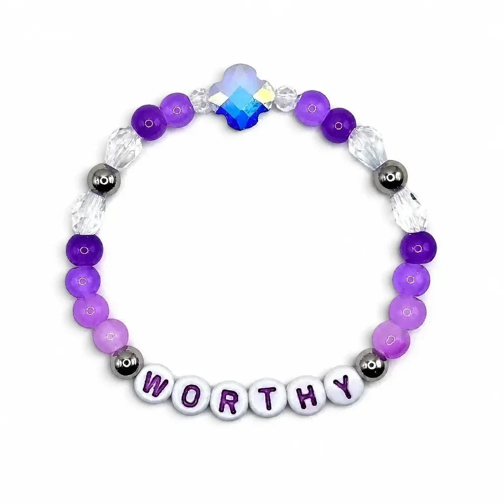 Handmade by Erika Liesel Worthy stretch bracelet with purple crystal beads, sterling silver accents, and letter beads.