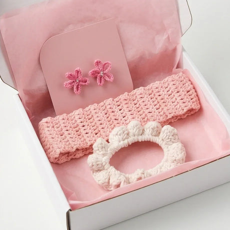 Handmade crochet headband, flower clips, and scrunchie in soft pink gift box
