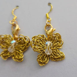 Handmade by Erika Liesel gold crochet butterfly drop earrings with sparkling crystal bead accents.