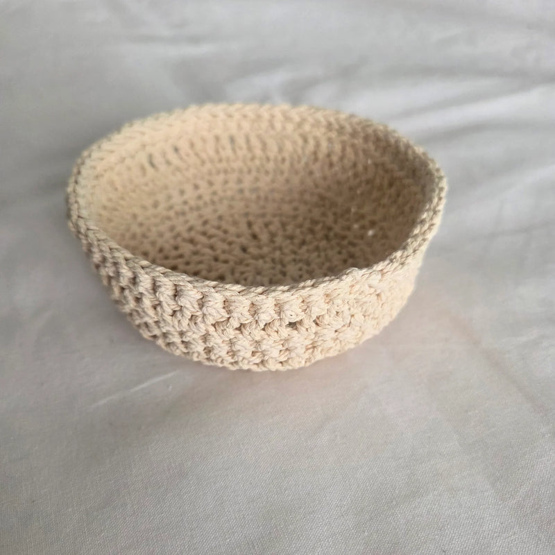 Handmade crochet bowl in neutral beige, perfect for cozy home decor or gifting