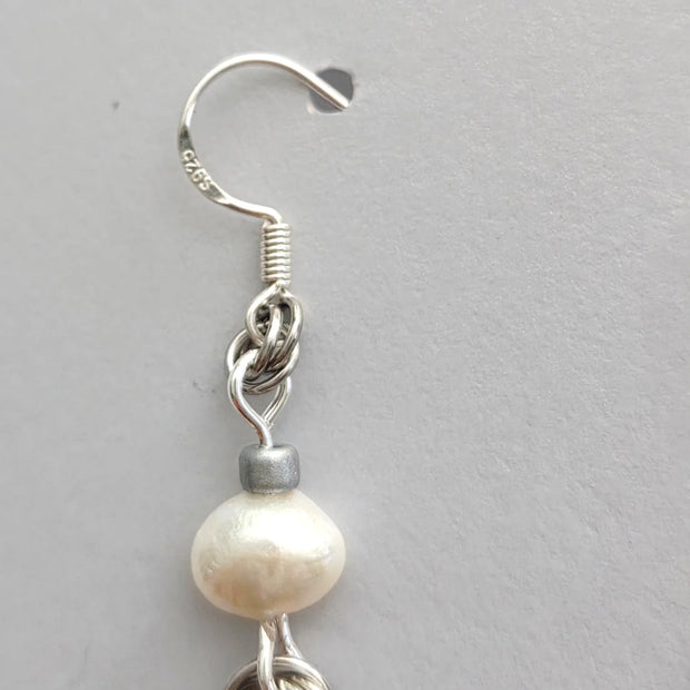 Handmade by Erika Liesel silver freshwater pearl drop earrings with delicate chain and hand-linked sterling silver rings