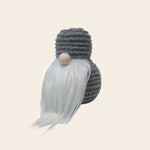 Handmade gray crochet gnome with white beard and wooden nose, cozy home decor