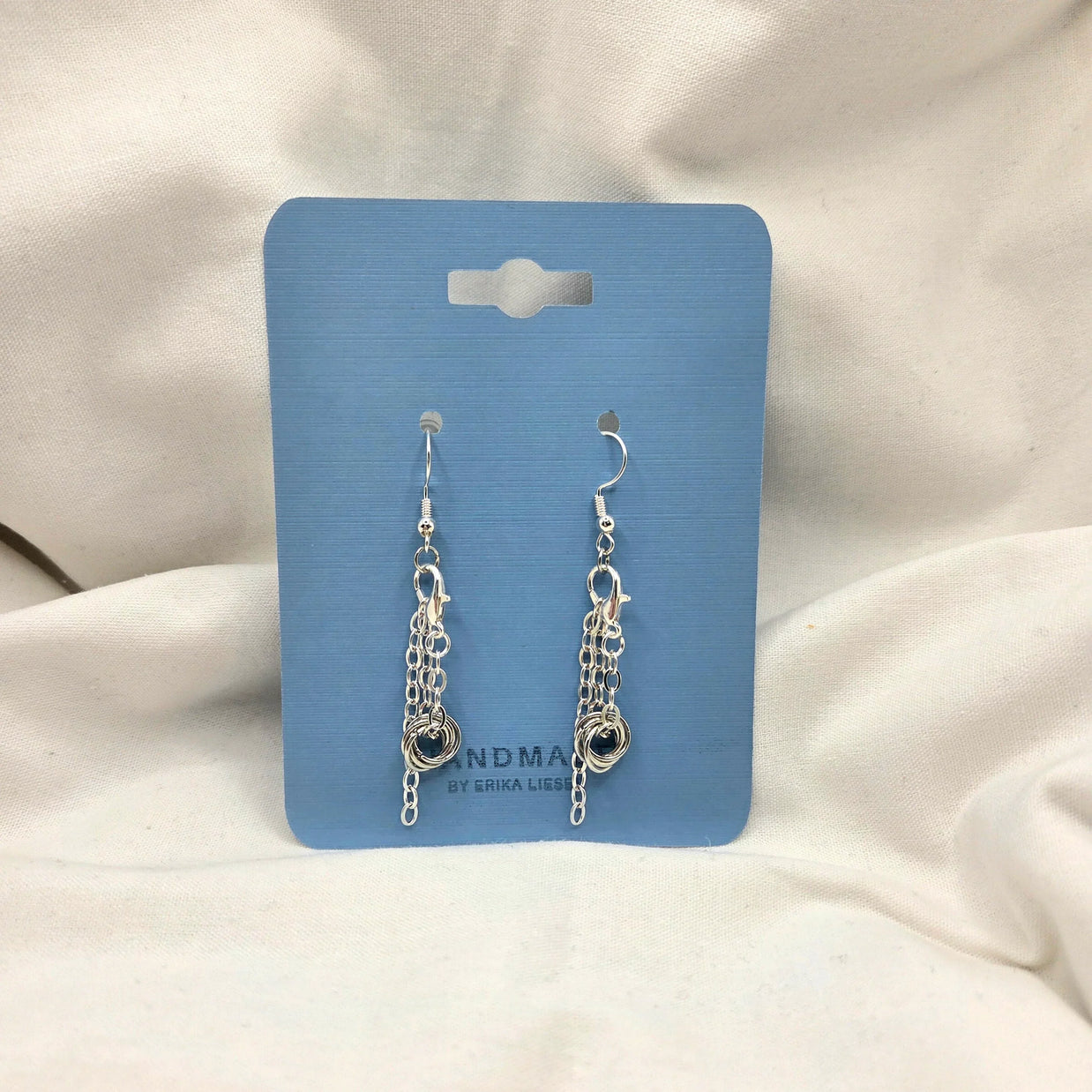 Silver chain link dangle earrings on blue display card, handmade jewelry gift