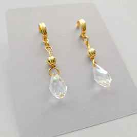 Handmade by Erika Liesel gold half-hoop drop earrings featuring faceted clear crystal beads and 18k gold accents.