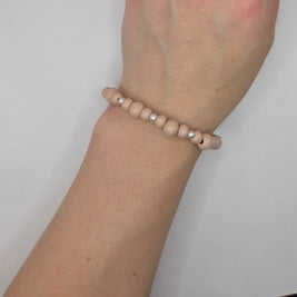 Handmade wooden bead bracelet with silver accents, cozy minimalist wrist accessory