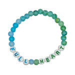 A beaded stretch bracelet on a plain white background, featuring a gradient of blue and green marbled beads transitioning into white letter beads that spell 'FULL HEART'.