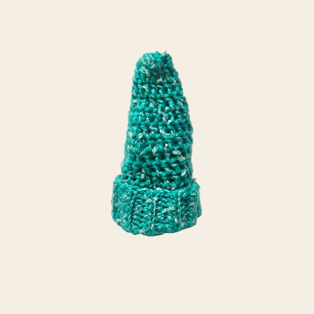 Handmade teal crochet Christmas tree decoration with white speckles, cozy holiday home decor