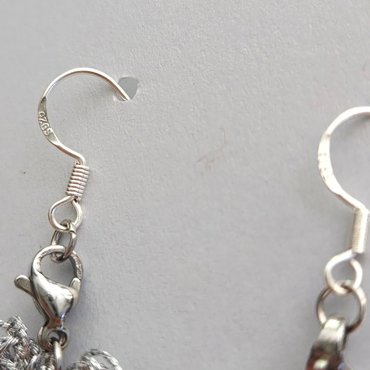 Handmade by Erika Liesel silver crochet butterfly earrings featuring sterling silver ear wires and lobster clasps