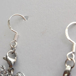Handmade by Erika Liesel silver crochet butterfly earrings featuring sterling silver ear wires and lobster clasps