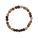 A beaded stretch bracelet featuring round brown and dark maroon beads with natural stone inclusions, accented by small gold spacer beads, displayed on a clean white background.