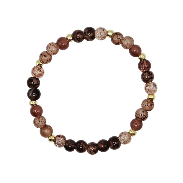 A beaded stretch bracelet featuring round brown and dark maroon beads with natural stone inclusions, accented by small gold spacer beads, displayed on a clean white background.