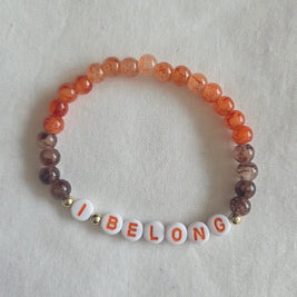I BELONG beaded bracelet with orange and brown marbled beads, cozy handmade accessory