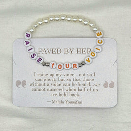 Raise Your Voice beaded bracelet with pearl accents, inspired by Malala Yousafzai's empowering quote on a shimmer card.