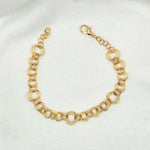 Gold-toned double link chain bracelet with lobster clasp on white fabric background